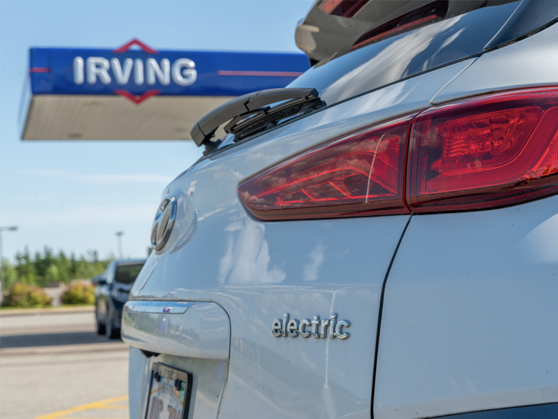 An electric vehicle at an Irving Oil gas station